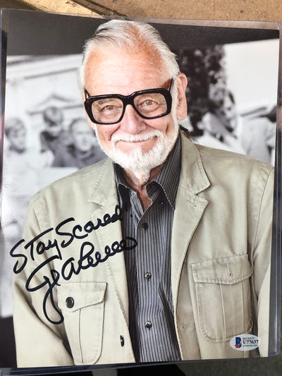 George Romero signed 8x10 w/inscription. Beckett coa